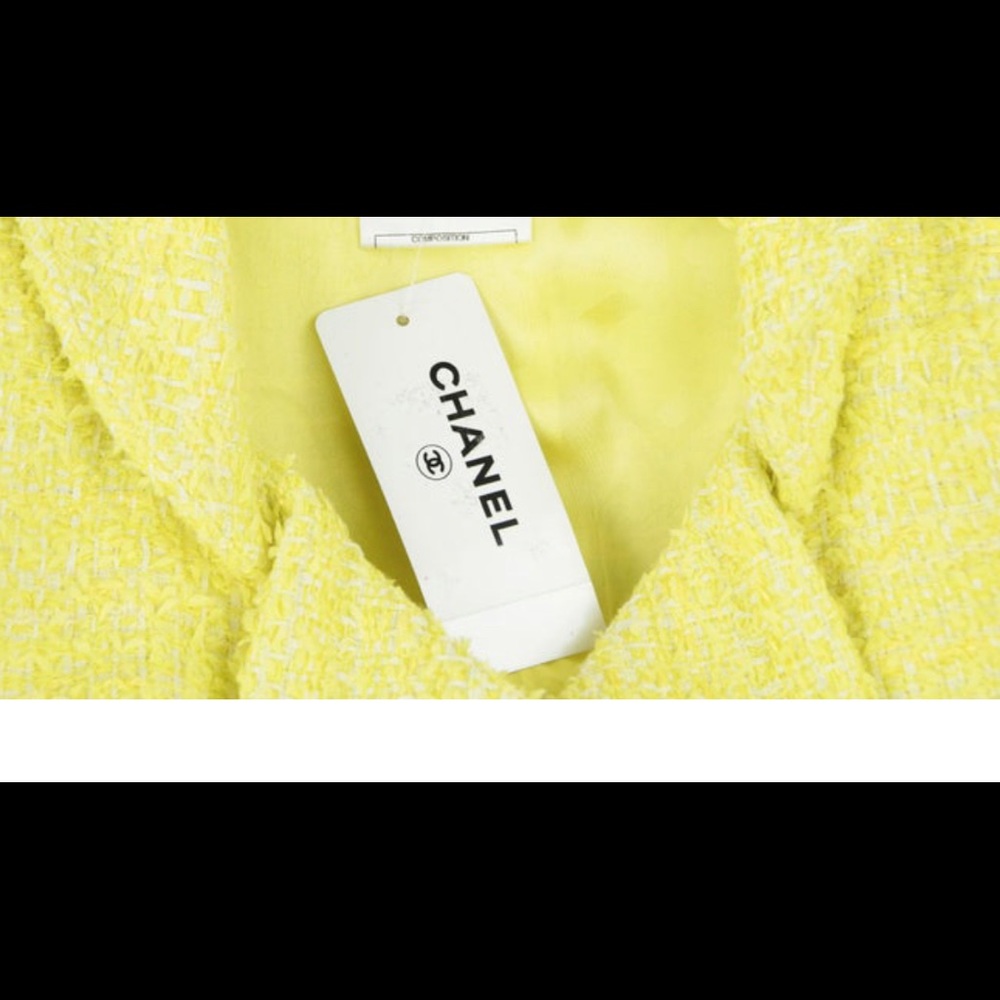 Brand new Chanel tweed dress with beautiful buttons. Head turner for sure.
